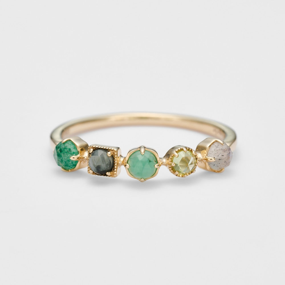 Best Japanese Jewelry Brands: 21 Labels to Know (2026) 9 agete yellow-gold multi-stone ring with five green and smoky gemstones in delicate mixed settings.